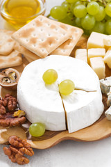 camembert, grapes and crackers, vertical closeup