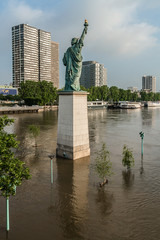 Flood in Paris: Liberty Statue on Swans Island flooded water.