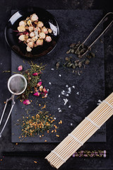 Variety of dry tea with teapot