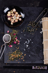 Variety of dry tea with teapot