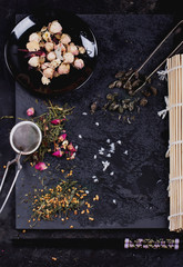 Variety of dry tea with teapot