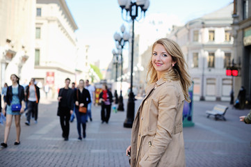 Happy woman walking inthe city
