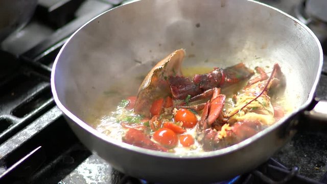 Cooking pasta with lobster in an Italian restaurant.