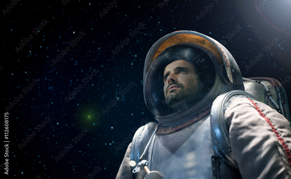 Wall mural astronaut looking at the infinite space