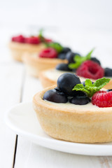 Delicious tartlets with raspberries and blueberries
