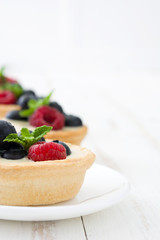 Delicious tartlets with raspberries and blueberries
