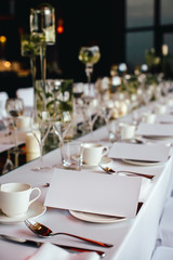 Served table with invitation, bokeh