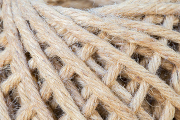Hemp ball on wooden table with selective focus background textur