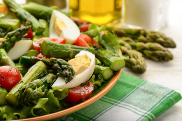 Delicius salad with green asparagus, tomatoes and eggs.