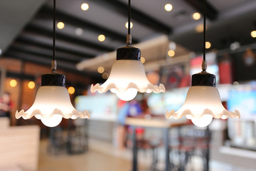 Warm lighting modern ceiling lamps in the cafe.