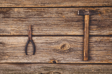 Construction equipment and tools on wooden table. Concept photograph taken from above, top view.