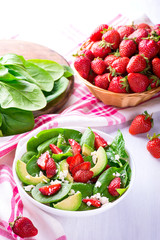 Summer salad with strawberry, avocado and spinach
