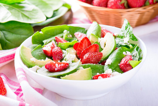 Summer salad with strawberry, avocado and spinach