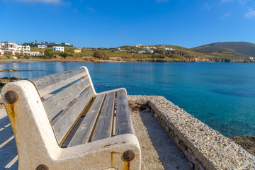 Traditional bench by the sea in Syros, Cyclades, Greece.