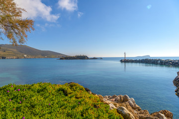 Small lighthouse in Cyclades, Greece during summer.
