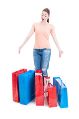 Female shopper standing and feeling enthusiastic with many shopp