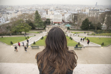 Young girl gazing at Paris