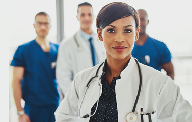 Black female doctor leading medical team