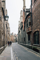 Empty Street in Cambridge with red brick buildings a cloudy day