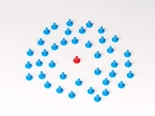 Random circular group with one standing out illustrated by coloured plastic board game hats in various colours, Melbourne 2016