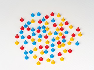 Random group illustrated by coloured plastic board game hats in various colours, Melbourne 2016