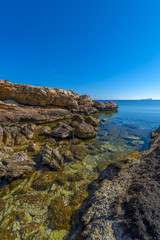Rocky beach in Mykonos, Cyclades, Greece.