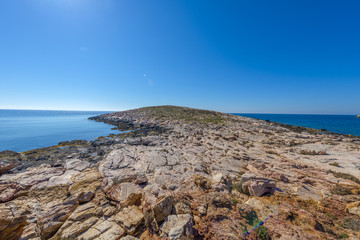 Rocky beach in Mykonos, Cyclades, Greece.