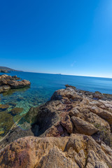 Rocky beach in Mykonos, Cyclades, Greece.