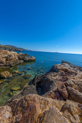 Rocky beach in Mykonos, Cyclades, Greece.