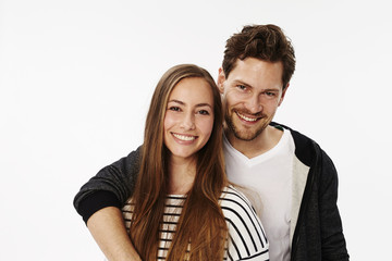 Smiling couple in white studio