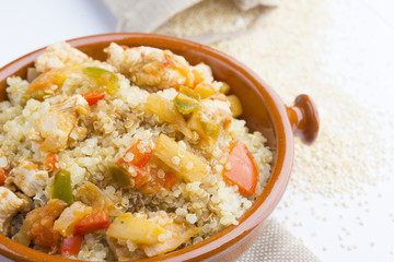 High-key image of white plate with quinoa lentil salad and bowl
