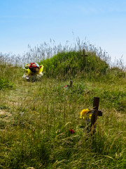 Wooden crosses on the edge of white chalk cliffs