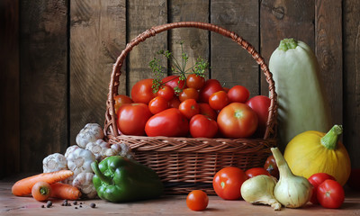 Vegetables in the basket on the table in the background of the b