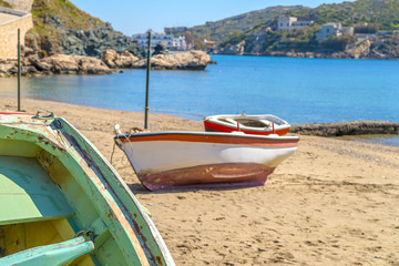 Fototapeta na wymiar Traditional fishing boat on the shore during a sunny summer day.