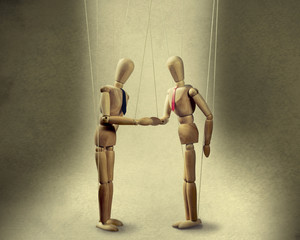 two puppets  shakes hands at the conclusion of the deal
