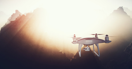 Photo White Matte Generic Design Modern Remote Control Drone action camera Flying in Sky under Earth Surface. Grand Canyon Sunset Background. Wide, back view.Film Effect. 3D rendering.