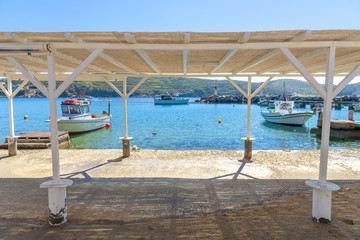 Traditional fishing boats in Syros, Cyclades, Greece. Bright sun