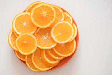 Ripe juicy oranges on a plate