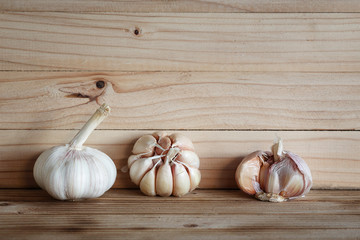 Garlic on wood background