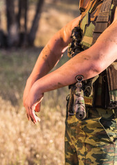 soldier in the uniform with weapon