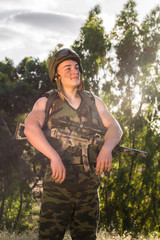 soldier in the uniform with weapon