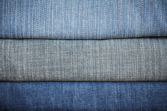 Blue denim jeans texture. blue jean fabric texture. Jeans background. Texture of blue jeans textile close up with copy space for text or image. Dark edged.