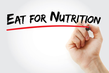 Fototapeta premium Hand writing Eat for nutrition with marker, health concept