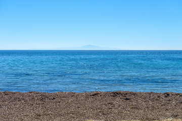Beautiful sandy beach in Syros, Cyclades, Greece. Crystal clear
