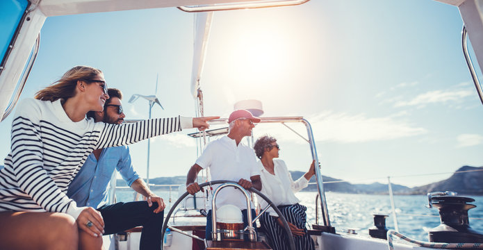 Group of people traveling in a yacht on a summer day