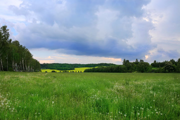 Field with clouds. Bad weather. Beautiful nature in Belarus. Summer in belarus. Dark clouds