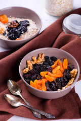 Oatmeal with raisins, dried apricots, plums