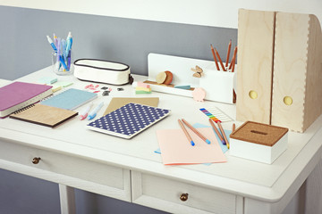 Office and school set with stationery and notebooks on a table