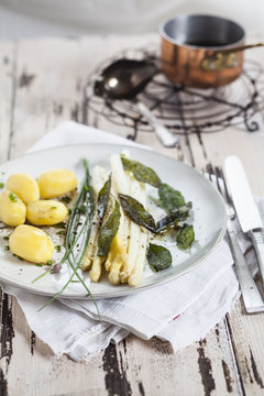 White asparagus with browned butter, fried sage leaves, boiled potatoes and chives
