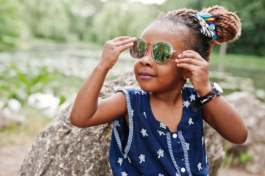 Cute African American Baby Girl At Sunglasses